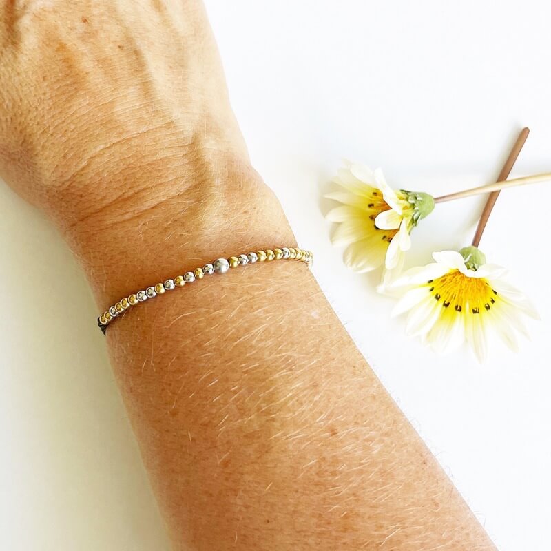 Morse Code Beaded Bracelet - Fuck Perfect on olive cord on woman's wrist