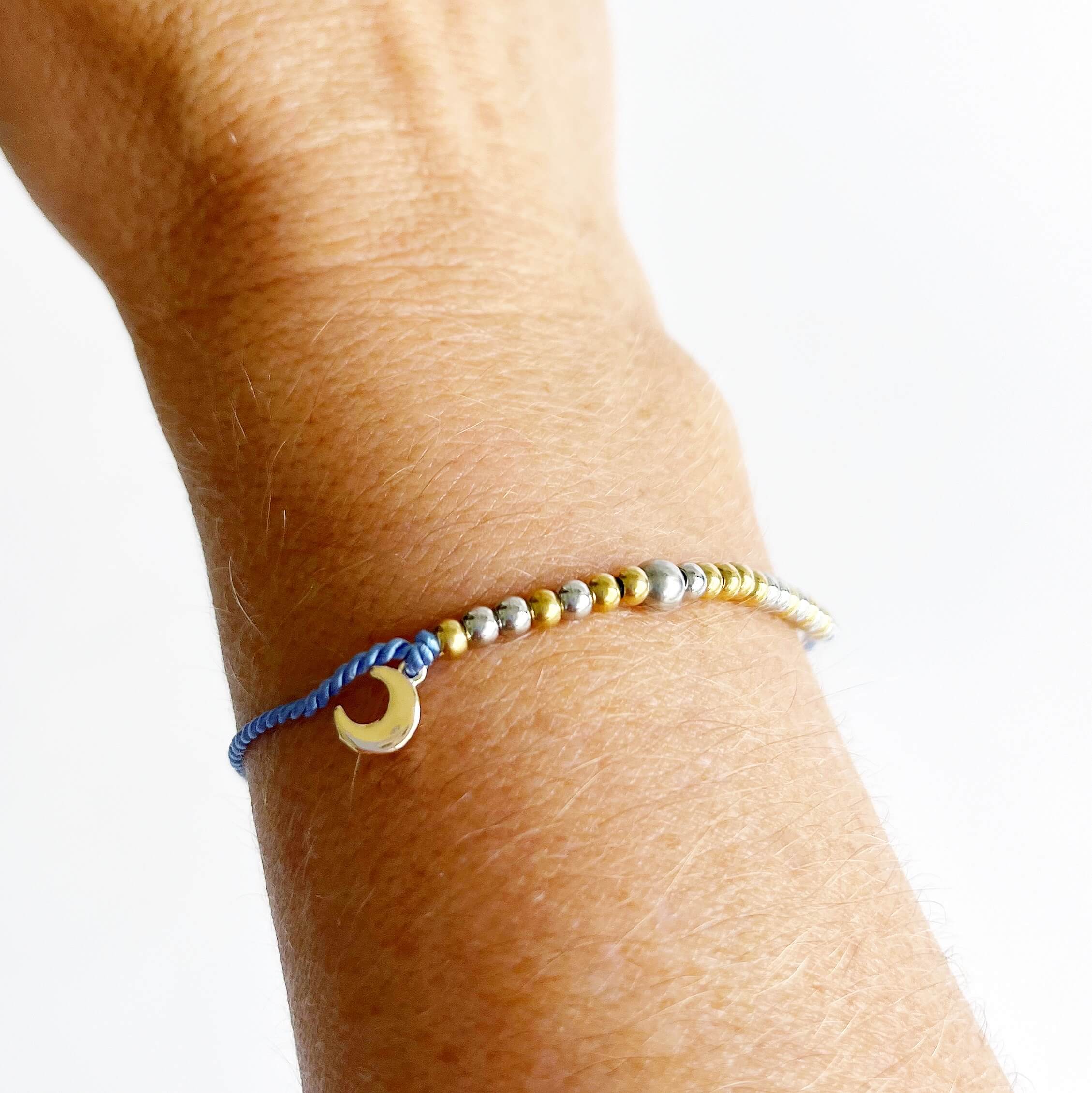 Morse Code and Charm Beaded Bracelet - Moon and Back with moon charm on woman's wrist