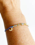 Morse Code and Charm Beaded Bracelet - Moon and Back with moon charm on woman's wrist