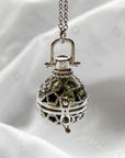 Round cage locket with green ribbon inside - Write Your Wish Locket