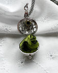 Round cage locket with green ribbon inside - Write Your Wish Necklace - locket is open to show the ribbon inside