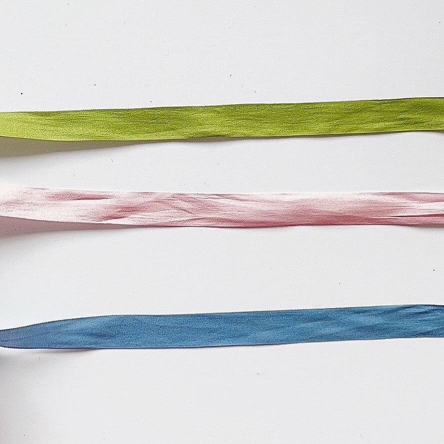 Green, pink, and blue silk ribbon