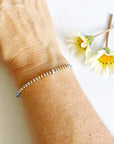 Morse Code Beaded Bracelet - Brave AF with light blue cord on woman's wrist