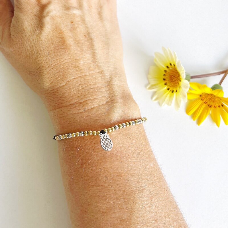 Faith Strength Morse Code and Charm Beaded bracelet with pineapple charm on woman&#39;s wrist