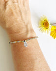 Faith Strength Morse Code and Charm Beaded bracelet with pineapple charm on woman's wrist