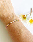 Morse Code Beaded Bracelet - Fuck it on pink cord on woman's wrist