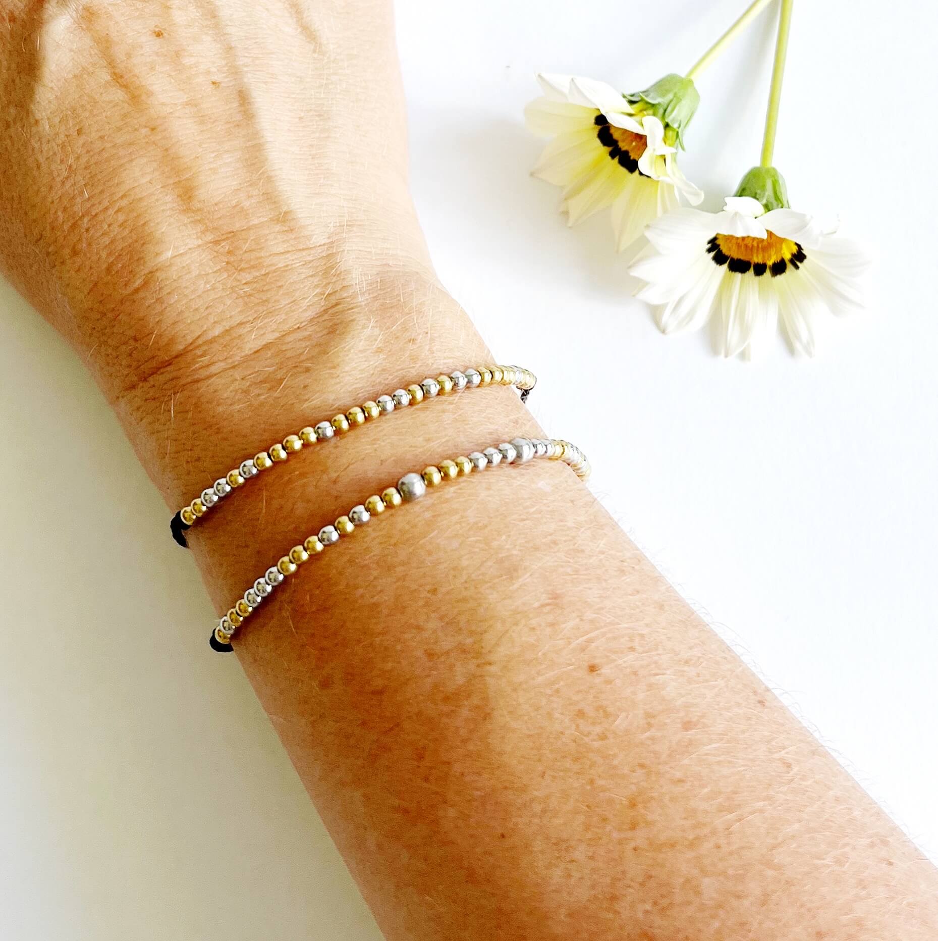 Morse code bracelets on a woman's wrist - unbreakable and loved so much