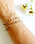 Morse code bracelets on a woman's wrist - unbreakable and loved so much