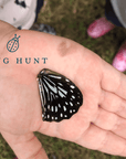 Girl's hand with a butterfly wing | Memory Makers Family Edition Bug Hunt